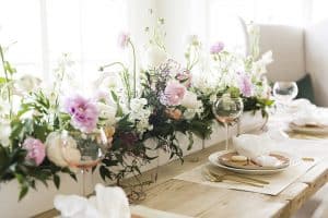 One of 5 easter tablescapes - this one has large floral bouquet runner and blush glasses.