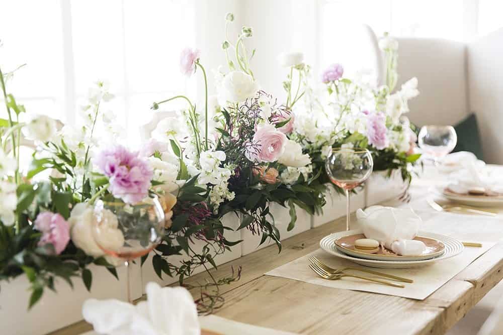 One of 5 easter tablescapes - this one has large floral bouquet runner and blush glasses.